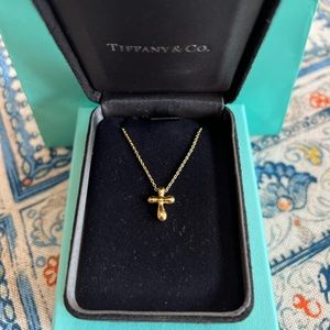 Tiffany & Co Elsa Peretti 18K yellow gold cross pendant necklace.